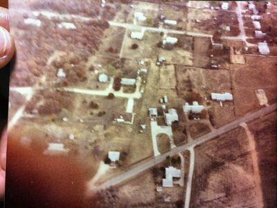 Aerial view, Azle: Louise and Thel's house is in the upper right. Below, with the gray U-shaped driveway, is her brother Stanley's house. Above and slightly left of Stanley's garage is the house they built for Granmama and Grandaddy (Ben Knight) to live in.